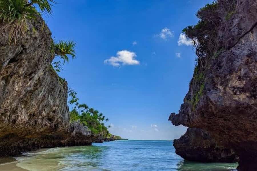 Kuza Cave, Hidden Mtende Beach & The Rock Restaurant - Mtende Beach on Zanzibar’s south coast: cliffs, powder sand, and tide walks