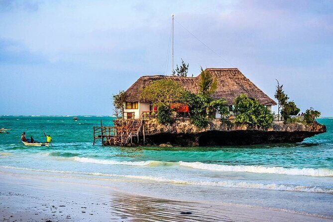 Mnemba Snorkeling; Kuza Cave; Paje Beach; The Rock; Salaam Cave - Stop 1: Mnemba Island for snorkeling, coral gardens, and dolphin time