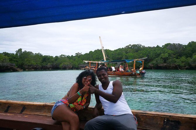Zanzibar Dhow Cruise day adventure, sea sports at Kwale Island, very memorable - The 500-year-old baobab tree stop: a small moment with big weight