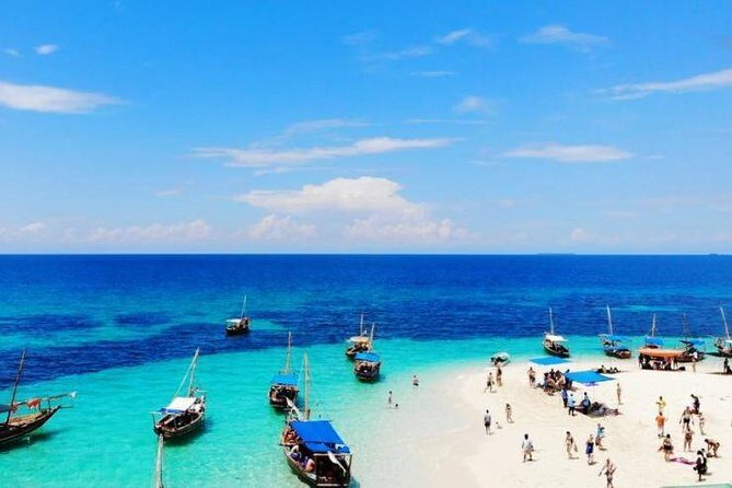 Zanzibar Dhow Cruise day adventure, sea sports at Kwale Island, very memorable - Sandbank stop: swim, snack, and scan for starfish