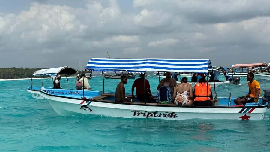 Zanzibar: Pungume island-dolphin watching - BBQ Lunch - Sandbank Chilling and Extra Stops: Photo Breaks, Swimming, and Sandboarding